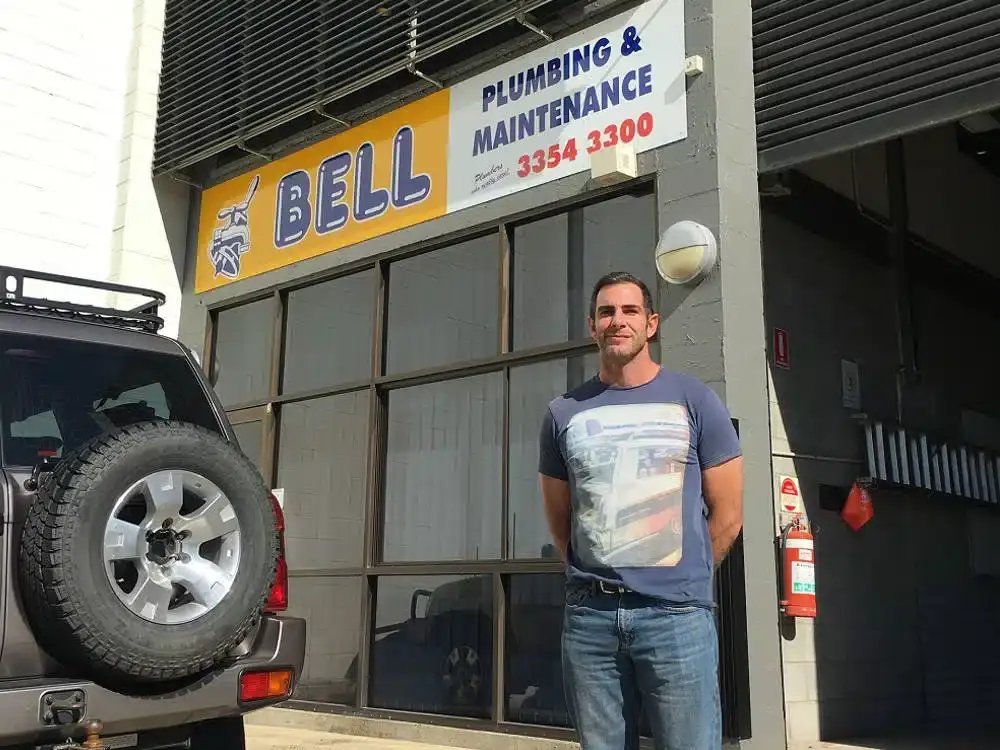 Adam standing outside the Bell Plumbing & Maintenance office