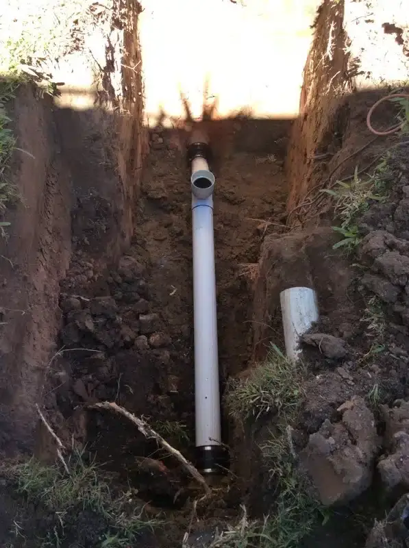 New PVC drain pipe laid in an open trench