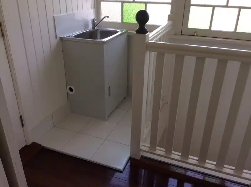 New laundry tub installed on a landing